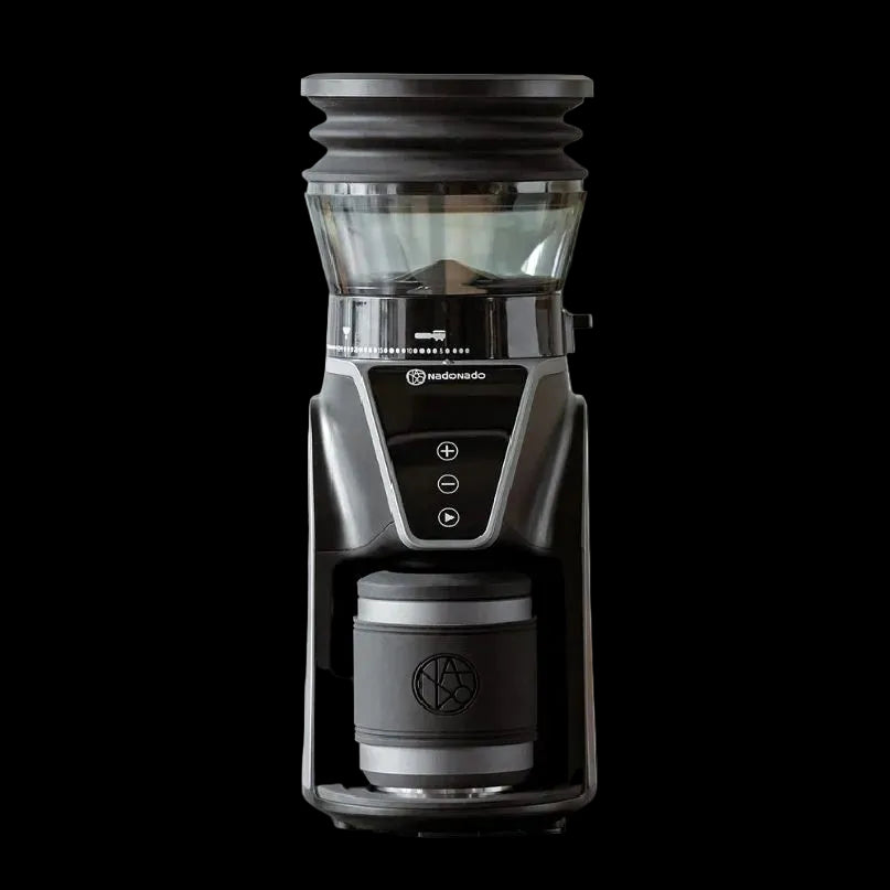 Black coffee grinder with clear top on a white background
